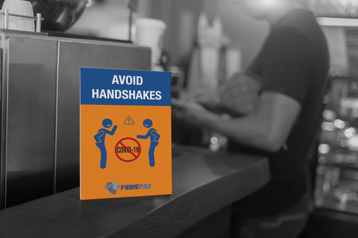 germ prevention sign stating to avoid handshakes